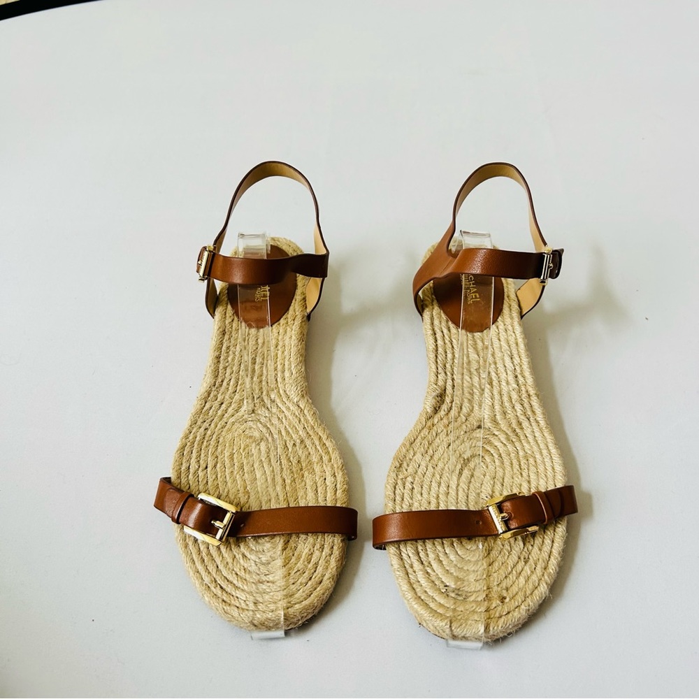 Michael Kors tan espadrilles flat sandals with straps and gold buckles. Size 10.